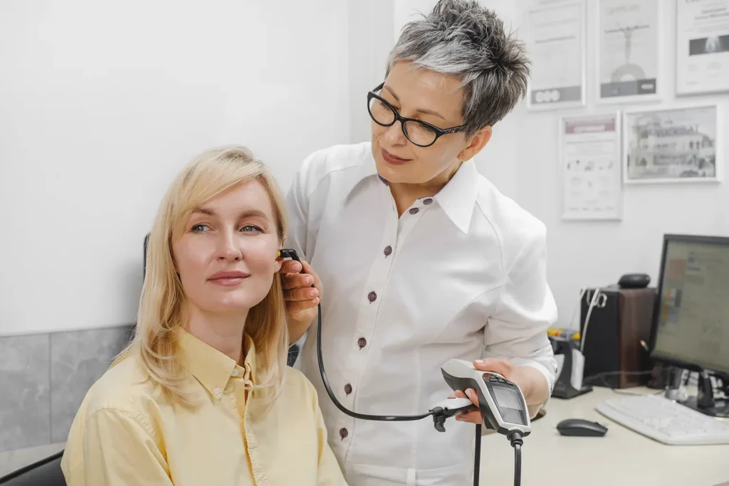 Rubicare audiology provider examines the patient's ear.