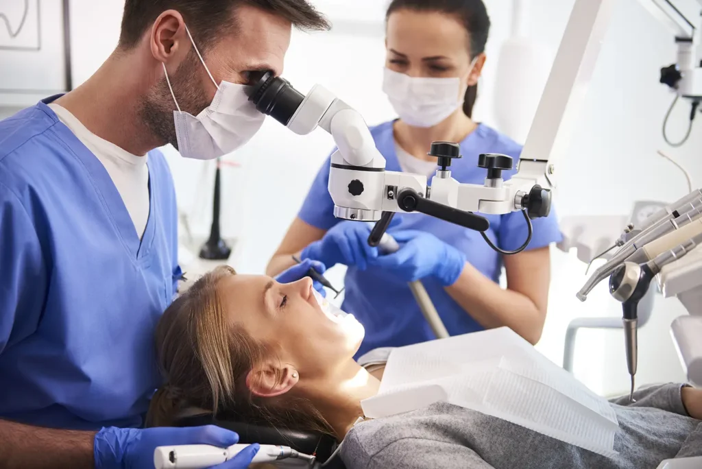 Dental professionals providing treatment at one of the top dental clinics in Billings, MT, using advanced equipment to ensure high-quality dental care.