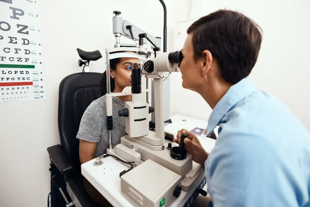 Optometrist conducting an eye exam, ensuring accurate vision care as part of Rubicare's Health Savings Plan.