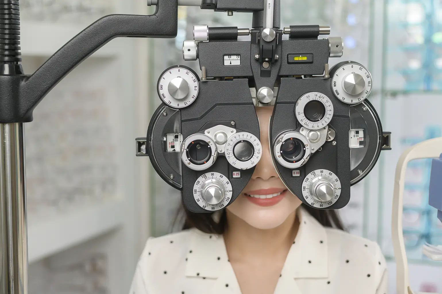 Patient undergoing comprehensive eye exams using advanced optometry equipment, provided through Rubicare's Health Savings Plan.